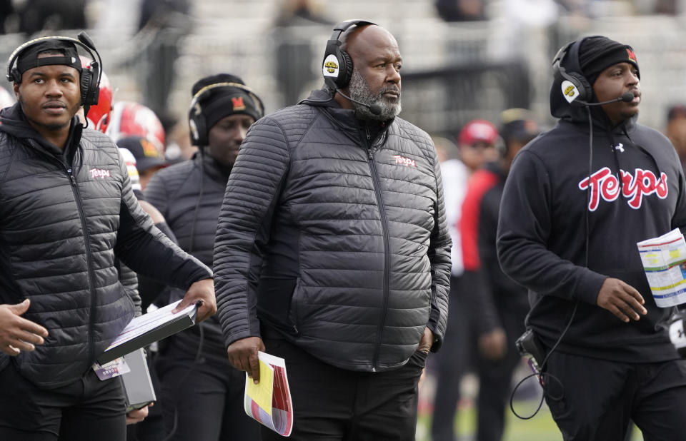 Oct. 28, 2023; Evanston, Illinois; Maryland Terrapins head coach Mike Locksley (center) on the sidelines during the second half at Ryan Field. David Banks-USA TODAY Sports