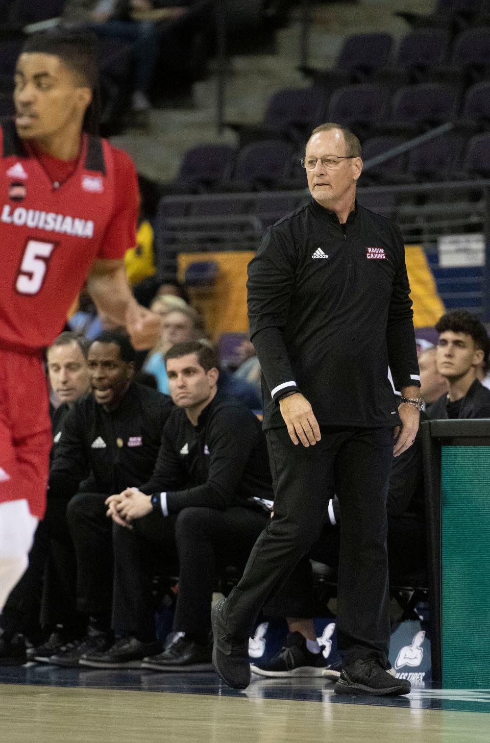 Louisiana Basketball Coach Bob Marlin keeps a watchful eye on his players during the Belt Conference Men's Basketball Championship game at the Pensacola Bay Center on Monday,  March 7, 2022. 