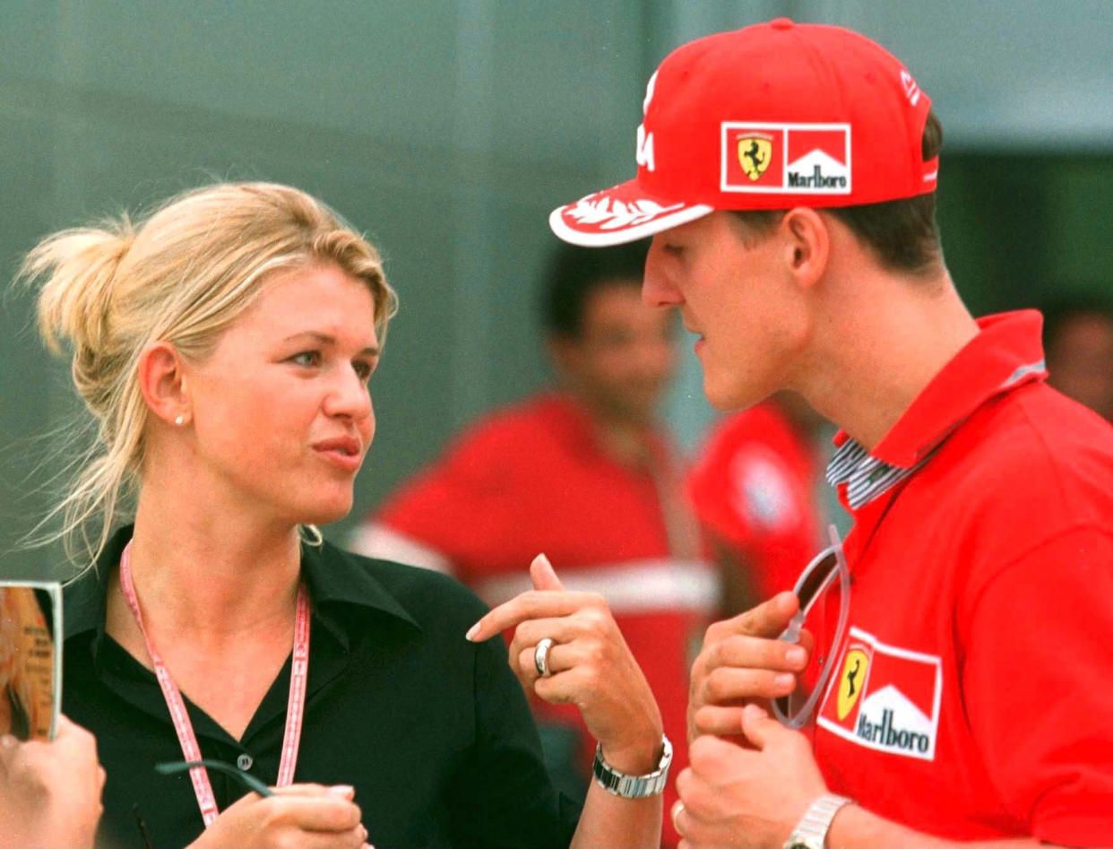 SEPANG, MALAYSIA - OCTOBER 16:  FORMEL 1: GP VON MALAYSIA 1999 Sepang, 16.10.99, Michael SCHUMACHER/FERRARI mit seiner Frau CORINNA im Fahrrerlager.  (Photo by Andreas Rentz/Bongarts/Getty Images)