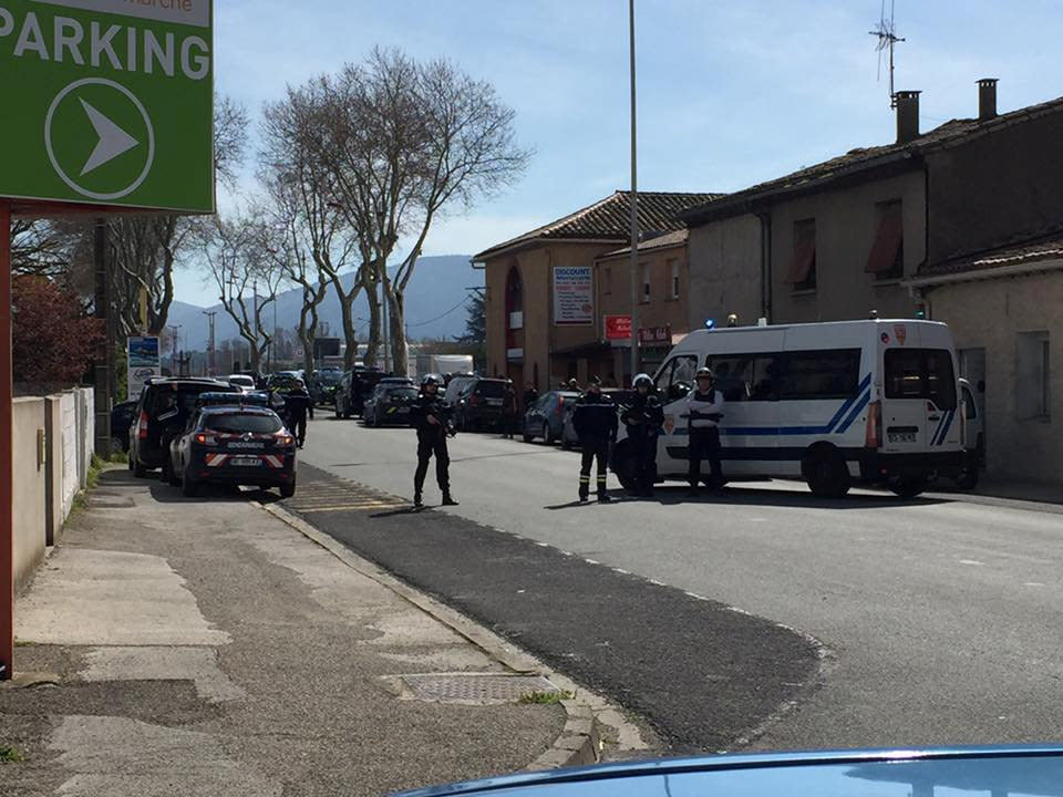 Police are seen at the scene of a hostage situation in a supermarket in Trebes, Aude, France March 23, 2018 in this picture obtained from a social media video. LA VIE A TREBES/via REUTERS ATTENTION EDITORS - THIS IMAGE WAS PROVIDED BY A THIRD PARTY. NO RESALES. NO ARCHIVES. MANDATORY CREDIT.