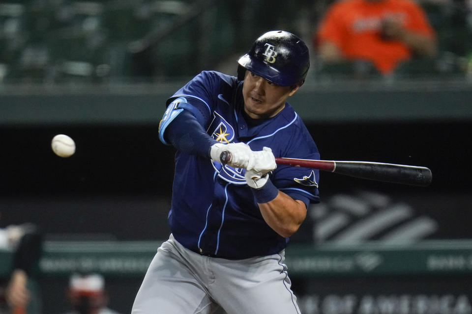 Tampa Bay Rays' Ji-Man Choi swings at a pitch from Baltimore Orioles relief pitcher Travis Lakins Sr. during the sixth inning of a baseball game, Tuesday, May 18, 2021, in Baltimore. (AP Photo/Julio Cortez)