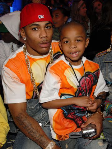 <p>Kevin Mazur/WireImage</p> Nelly and his son Cornell at the Pauley Pavilion in Westwood, California