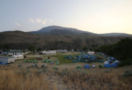 Wildfire fighters return to their camp in the town of Cache Creek, British Columbia, Canada July 18, 2017. Picture taken July 18, 2017. REUTERS/Ben Nelms