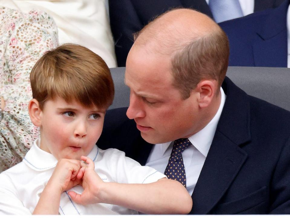 Prince William holds Prince Louis on his lap