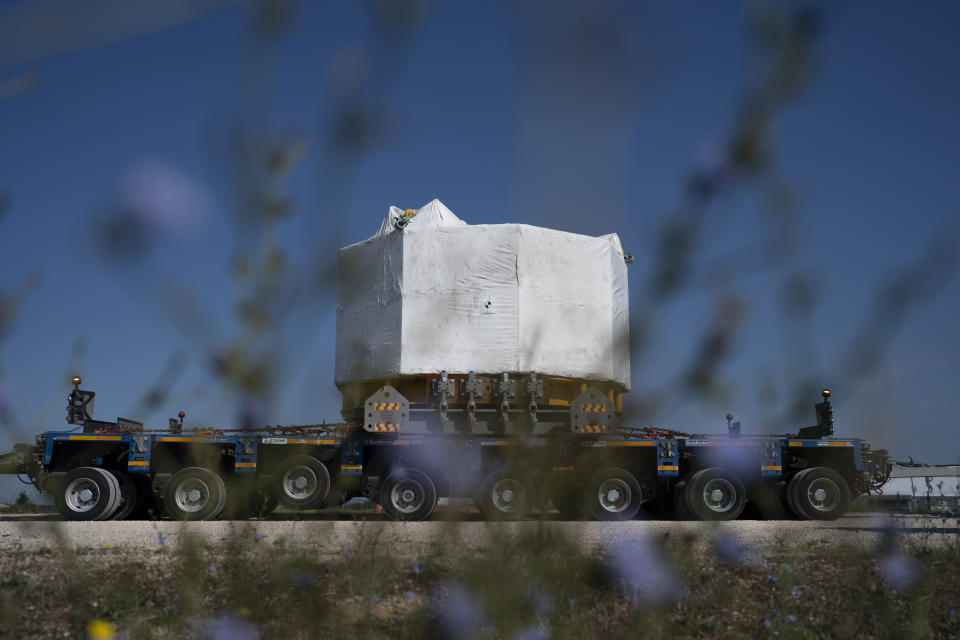 A central solenoid magnet for the ITER project departs from Berre-l'Etang in southern France, Monday, Sept. 6, 2021. The first part of a massive magnet so strong its American manufacturer claims it can lift an aircraft carrier arrived Thursday, Sept. 9, 2021 at a high-security site in southern France, where scientists hope it will help them build a 'sun on earth.' Almost 60-feet tall and 14 feet in diameter when fully assembled, the magnet is a crucial component of the International Thermonuclear Experimental Reactor, or ITER, a 35-nation effort to develop an abundant and safe source of nuclear energy for future generations. (AP Photo/Daniel Cole)