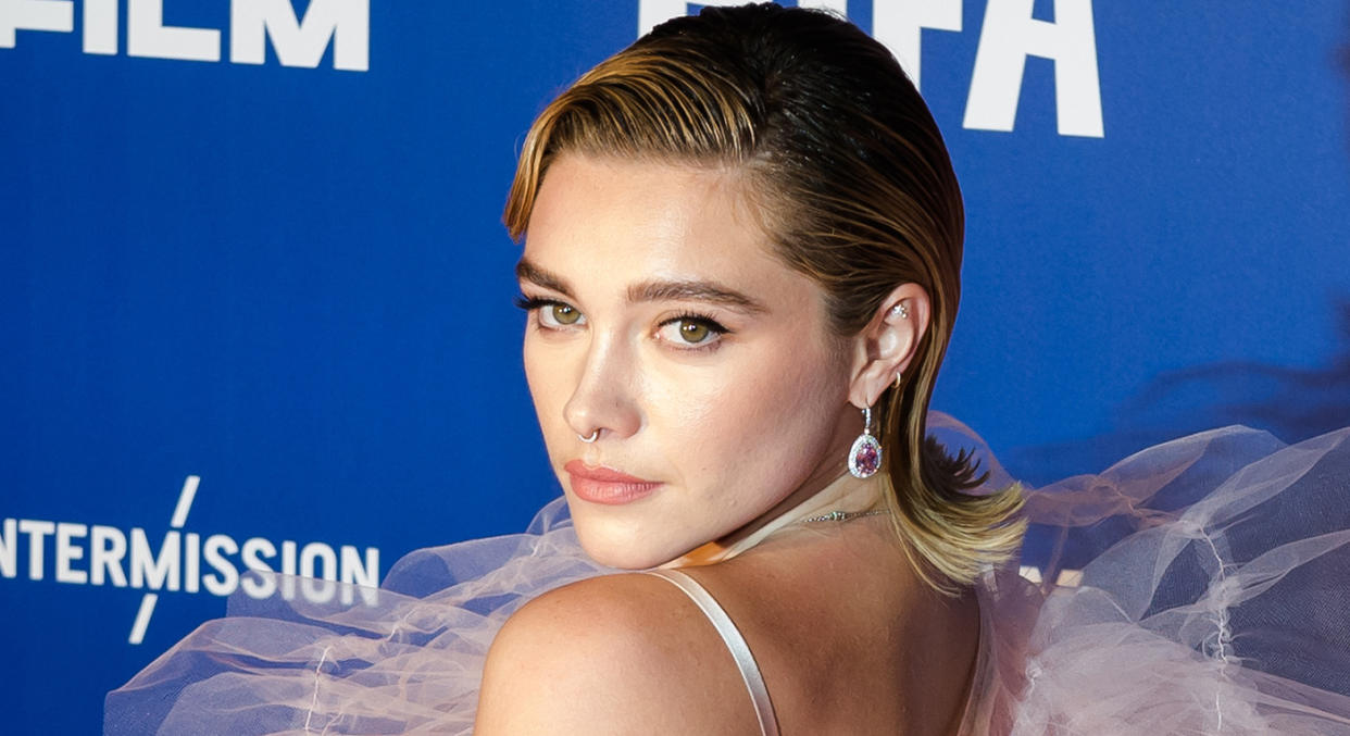 Florence Pugh posed up a storm with her flowing cape on the British Independent Film Awards red carpet. (Getty Images)