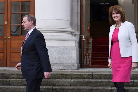 Ireland's Taoiseach Enda Kenny and Tanaiste Joan Burton depart Government Buildings after announcing the beginning of the General Election in Dublin, Ireland on February 03, 2016. REUTERS/Clodagh Kilcoyne