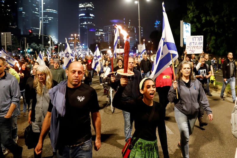 FILE PHOTO: Israelis protest Prime Minister Benjamin Netanyahu's new right-wing coalition and its proposed judicial reforms, in Tel Aviv