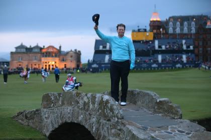 United States&#39; Tom Watson doffs his cap as he poses on the Swilcan Bridge for photographers during the second round of the British Open Golf Championship at the Old Course, St. Andrews, Scotland, Friday, July 17, 2015. (AP Photo/Peter Morrison)