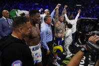 Andy Ruiz, Jr., center, celebrates after winning a WBC world heavyweight title eliminator boxing match against Luis Ortiz, second from left, Sunday, Sept. 4, 2022, in Los Angeles. (AP Photo/Ashley Landis)