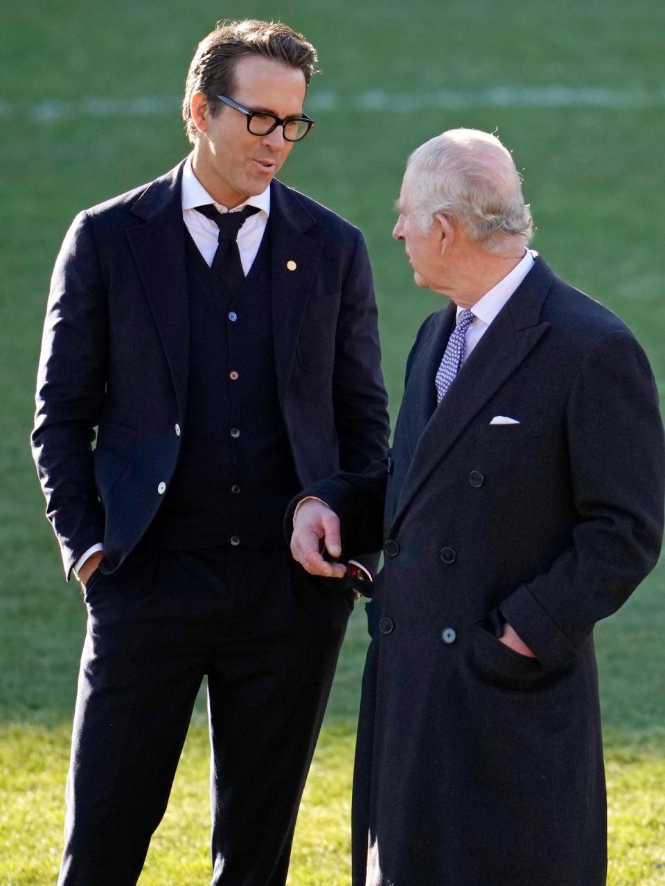 King Charles III talks to Co-Owner Wrexham AFC Ryan Reynolds (L) during their visit to Wrexham AFC (Getty Images)