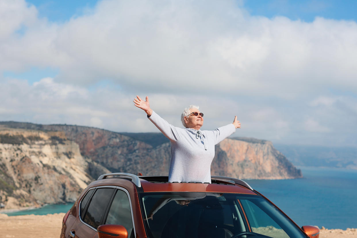 Older woman enjoying the sun and sea