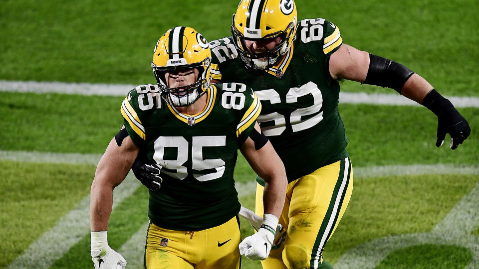 GREEN BAY, WISCONSIN - OCTOBER 05: Robert Tonyan #85 of the Green Bay Packers celebrates with Lucas Patrick #62 after scoring a touchdown during the second quarter against the Atlanta Falcons at Lambeau Field on October 05, 2020 in Green Bay, Wisconsin. (Photo by Stacy Revere/Getty Images)