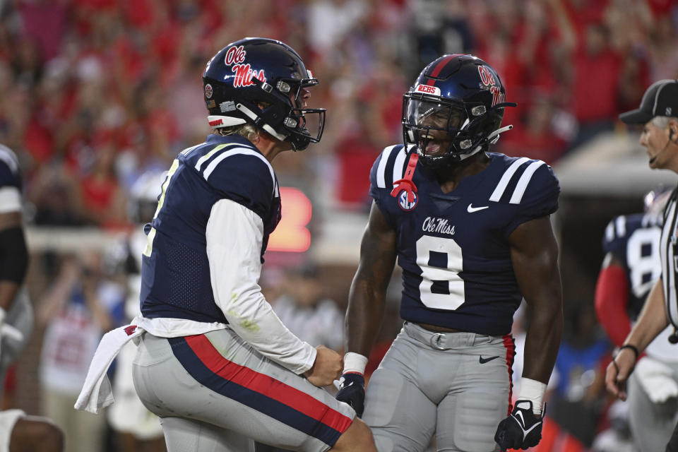 Mississippi quarterback Jaxson Dart (2) and running back Jamious Griffin (8) celebrate a touchdown by Dart against Georgia Tech during the first half an NCAA college football game in Oxford, Miss., Saturday, Sept. 16, 2023. (AP Photo/Thomas Graning)