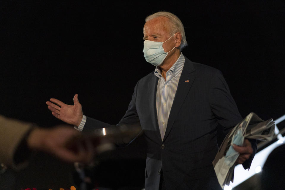 Democratic presidential candidate former Vice President Joe Biden speaks to the media as he arrives at New Castle Airport, Saturday, Oct. 10, 2020, in New Castle, Del., as he returns from Erie, Pa. (AP Photo/Carolyn Kaster)