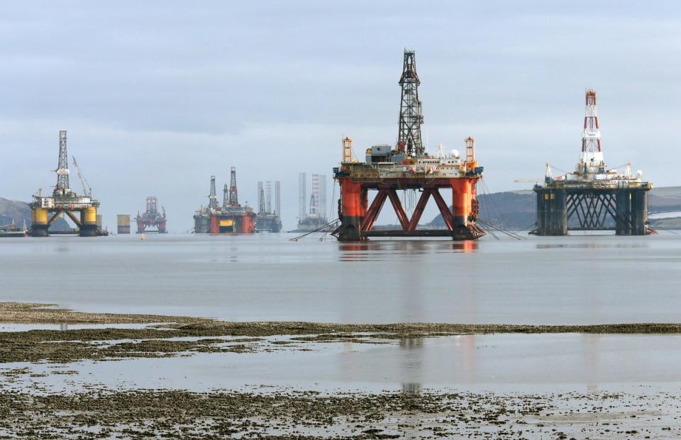 Oil rigs in Cromarty Firth off the coast of Scotland (PA)