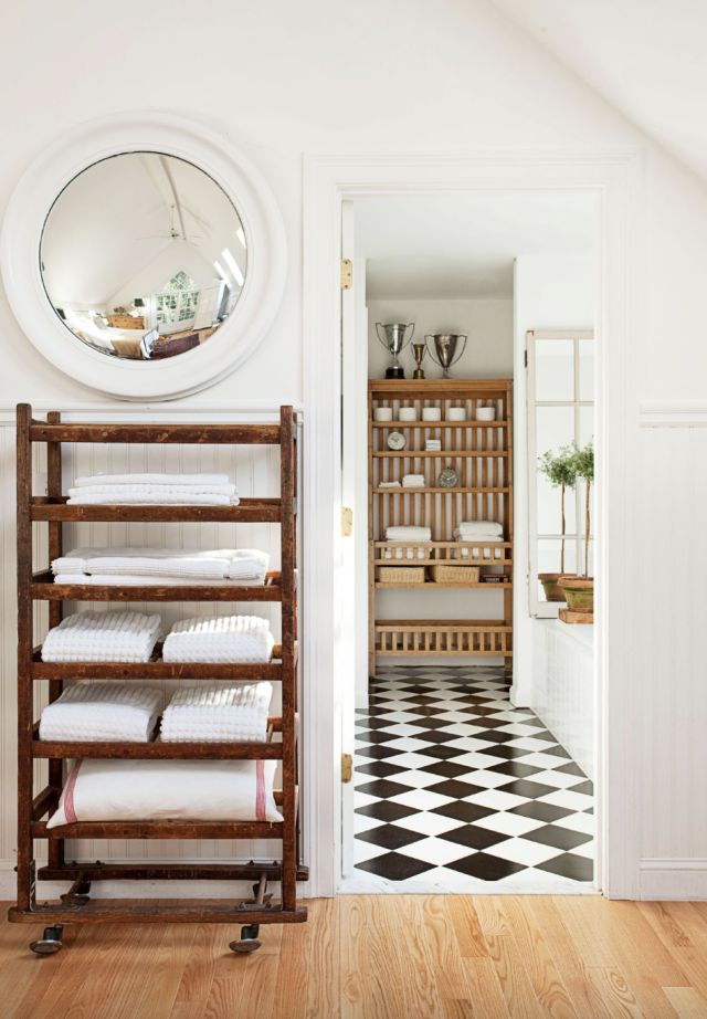 Staging modern bathroom with two decorated brown hand and body towels  hanging on rack by shower in model home, apartment or house Stock Photo -  Alamy