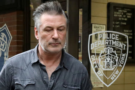 FILE PHOTO: Actor Alec Baldwin exits the 6th precinct of the New York Police Department in Manhattan, New York, U.S., November 2, 2018. REUTERS/Andrew Kelly/File Photo