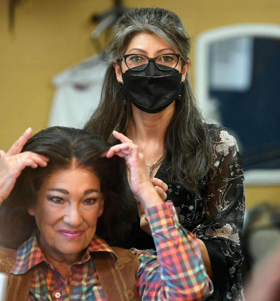 Asolo Rep hair, wig and make-up designer Michelle Hart helps actress Suzanne Grodner with her wig before a recent performance of “Incident at Our Lady of Perpetual Help.”