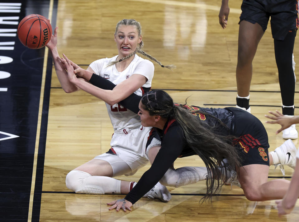 Stanford forward Cameron Brink (22) attempts to pass as Southern California forward Alissa Pili (35) defends during an NCAA college basketball game in the second round of the Pac-12 women's tournament Thursday, March 4, 2021, in Las Vegas. (AP Photo/Isaac Brekken)