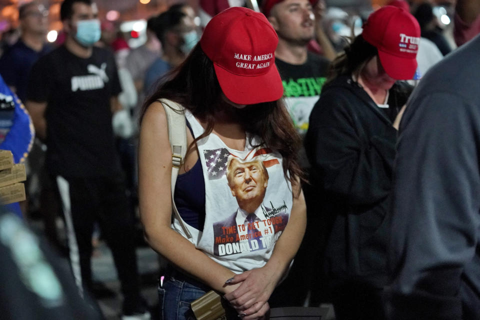 Supporters of President Donald Trump pause for prayer during a rally outside the Maricopa County Recorders Office, Wednesday, Nov. 4, 2020, in Phoenix. (AP Photo/Matt York)