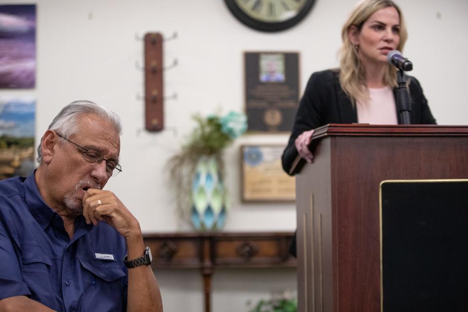 Santos Ronje listens to defense attorney Lisa Greenberg talk about a mentally ill client at the Nueces County Commissioners Court meeting in Corpus Christi, Texas, on April 19, 2022.