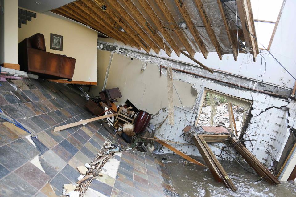 A destroyed house with furniture still intact inside is seen in Jamestown, Colorado, after a flash flood destroyed much of the town, September 14, 2013. Colorado farming communities along the South Platte River were ordered to evacuate ahead of a predicted surge in the flooding, which may have claimed a fifth life and has left many still unaccounted for, authorities said on Saturday. REUTERS/Rick Wilking