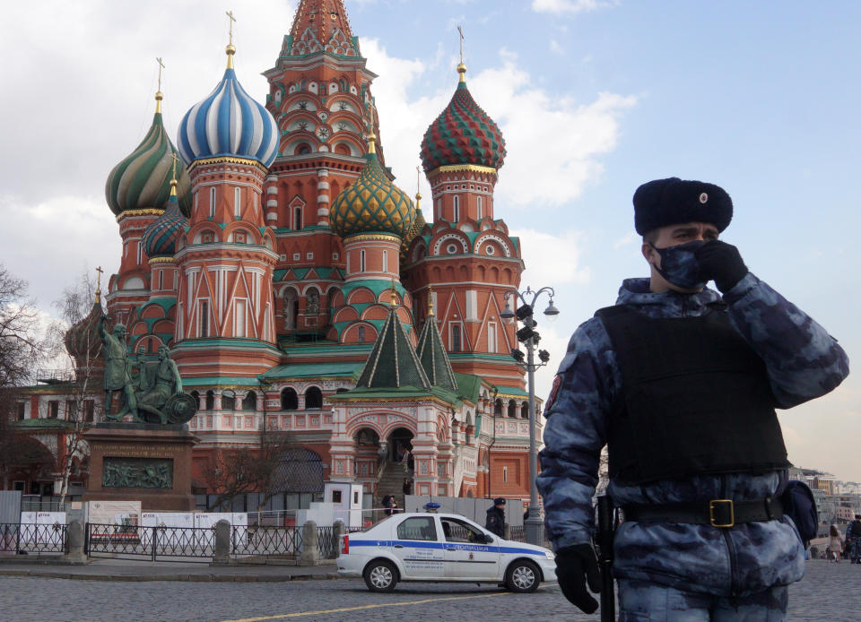 A national guard service officer in front of the Saint Basil's Cathedral in Moscow.The FTSE 100 tracked a rally in Asia markets. Photo: Mikhail Svetlov/Getty 