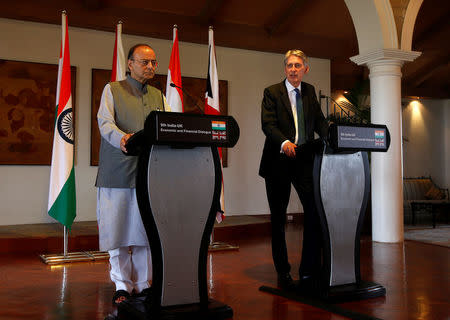 Britain's Chancellor of the Exchequer Philip Hammond (R) speaks during a joint news conference with India's Finance Minister Arun Jaitley in New Delhi, India April 4, 2017. REUTERS/Altaf Hussain