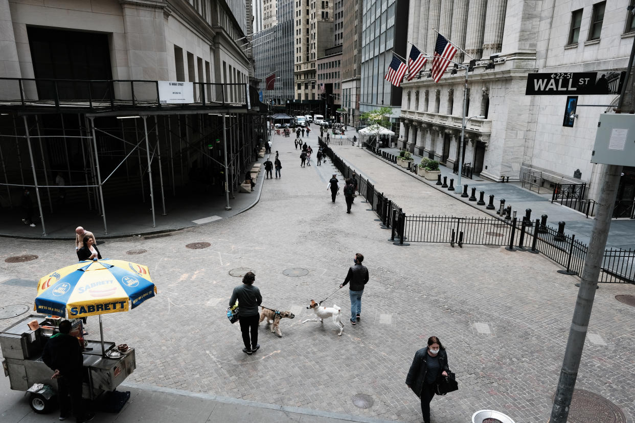 NEW YORK, NEW YORK - MAY 11: People walk by the New York Stock Exchange after global stocks fell as concerns mount that rising inflation will prompt central banks to tighten monetary policy on May 11, 2021 in New York City. By mid afternoon the tech-heavy Nasdaq Composite had lost 0.6% after falling 2.2% at its session low.  (Photo by Spencer Platt/Getty Images)