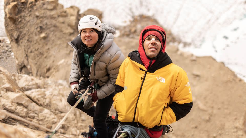 Climbers Alex Honnold, right, and Hazel Findlay assess the route ahead as they ascend Pool Wall, one of the stops before Ingmikortilaq, in Eastern Greenland. - Pablo Durana/National Geographic