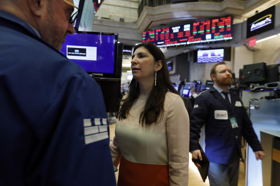 New York Stock Exchange President Stacey Cunningham consults with specialist Peter Giacchi, left, on the floor of the NYSE, Monday, March 9, 2020. The Dow Jones Industrial Average plummeted 1,500 points, or 6%, following similar drops in Europe after a fight among major crude-producing countries jolted investors already on edge about the widening fallout from the outbreak of the new coronavirus. (AP Photo/Richard Drew)