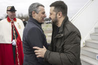 Switzerland's Foreign Minister Federal Councillor Ignazio Cassis, center, welcomes Ukrainian President Volodymyr Zelenskyy upon his arrival at Zurich's Kloten airport, Switzerland, Monday, Jan. 15, 2024. Zelenskyy is in Switzerland to attend the World Economic Forum in Davos starting Tuesday. (Alessandro della Valle/Keystone via AP)