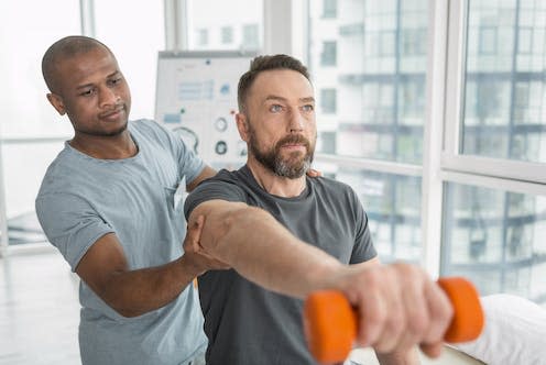 <span class="caption">Physical activity during cancer treatment can help improve mental and physical health outcomes.</span> <span class="attribution"><a class="link " href="https://www.shutterstock.com/image-photo/physical-rehabilitation-nice-pleasant-adult-man-1070432831" rel="nofollow noopener" target="_blank" data-ylk="slk:Dmytro Zinkevych/ Shutterstock;elm:context_link;itc:0;sec:content-canvas">Dmytro Zinkevych/ Shutterstock</a></span>