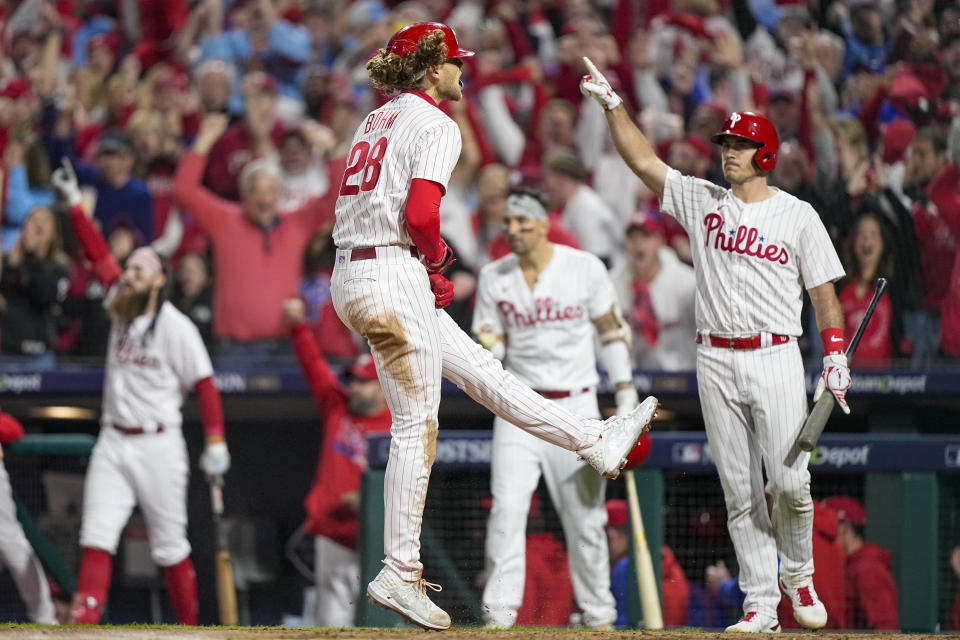 Philadelphia Phillies' Alec Bohm celebrates after scoring on a double by Bryson Stott against the Arizona Diamondbacks during the fourth inning in Game 7 of the baseball NL Championship Series in Philadelphia Tuesday, Oct. 24, 2023. (AP Photo/Brynn Anderson)