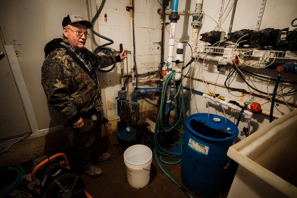 Water treatment plant operator Jim Edens demonstrates how the automated water system works that he designed and built himself for District #20.