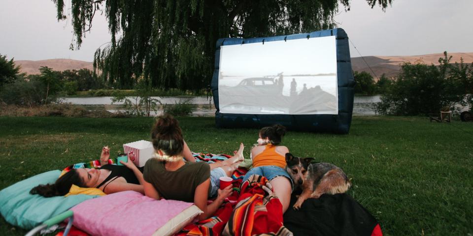 <p>Whether it's a block party or an intimate date night, there's just something dreamy about watching a movie under the stars. It takes a little preparation and some purchasing power to <a href="https://www.howtogeek.com/227672/the-htg-guide-to-throwing-a-backyard-movie-night/" rel="nofollow noopener" target="_blank" data-ylk="slk:lay the foundation for your first screening;elm:context_link;itc:0;sec:content-canvas" class="link ">lay the foundation for your first screening</a>, but it's an investment that's well worth the time and expense. You'll need a projector with enough power to shine through the light pollution in your area and, of course, a surface to project the movie onto. Depending on your projector's capabilities, you may want to boost the volume with <a href="https://www.bestproducts.com/tech/electronics/g1329/best-outdoor-speakers-with-wires/" rel="nofollow noopener" target="_blank" data-ylk="slk:speakers;elm:context_link;itc:0;sec:content-canvas" class="link ">speakers</a>, too.</p><p>While you <em>could</em> project onto a flat wall, fence, or bed sheet, there's no doubt about it — you'll get the best picture quality with a screen. First, assess your space's access to a power source to decide if you want an inflatable or pulldown screen. Then figure out what surface you'll be sitting on, so you know how the screen can be stabilized. An inflatable screen, for example, will need a power source for its fan and grass or dirt for the stakes that support it. </p><p>Once you have the tech angles figured out, add in layers of comfort so that you and your guests can sit through a 2-hour movie without aching backs or bug attacks. Consider who is in your audience when you're deciding on seating. Adults will want supportive beach chairs or outdoor loungers, while kids can be comfy on the ground with blankets and pillows. </p><p><a href="https://www.bestproducts.com/home/outdoor/g1459/citronella-candles-to-keep-mosquitos-away/" rel="nofollow noopener" target="_blank" data-ylk="slk:Keep the citronella burning;elm:context_link;itc:0;sec:content-canvas" class="link ">Keep the citronella burning</a> to ward off mosquitoes, and turn on a few <a href="https://www.bestproducts.com/appliances/small/g1068/outdoor-solar-lights/" rel="nofollow noopener" target="_blank" data-ylk="slk:outdoor lights;elm:context_link;itc:0;sec:content-canvas" class="link ">outdoor lights</a> so guests can get up and move about safely. Of course, no movie theater is complete without a concession stand. Load up on <a href="https://www.bestproducts.com/eats/gadgets-cookware/a35491044/popco-popcorn-maker-feb-2021-deal/" rel="nofollow noopener" target="_blank" data-ylk="slk:popcorn;elm:context_link;itc:0;sec:content-canvas" class="link ">popcorn</a> and snacks, and keep your drinks close and cold with a stocked cooler and insulated cups. </p><p>From the readymade <a href="https://www.popularmechanics.com/home/how-to-plans/a32382000/build-a-backyard-movie-screen/" rel="nofollow noopener" target="_blank" data-ylk="slk:to the DIY;elm:context_link;itc:0;sec:content-canvas" class="link ">to the DIY</a>, you have lots of options for how to set up your perfect outdoor movie night at home. We've picked our favorite items to make it easy to start your screening under the stars. </p>