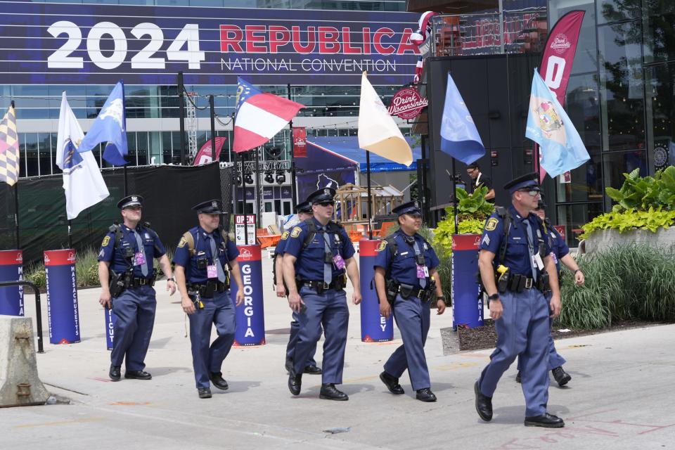 Jul 14, 2024; Milwaukee, WI, USA; Michigan State Police officers patrol outside of the Fiserv Forum as preparations continue ahead of the start of the Republican National Convention. Security was on high alert at the site of the RNC in Milwaukee, a day after an attempted assassination of former President Donald Trump on Sunday at a rally in Pennsylvania.