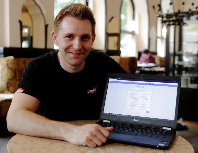 FILE PHOTO: Austrian lawyer and privacy activist Schrems displays his Facebook account's updated terms page during a Reuters interview in Vienna