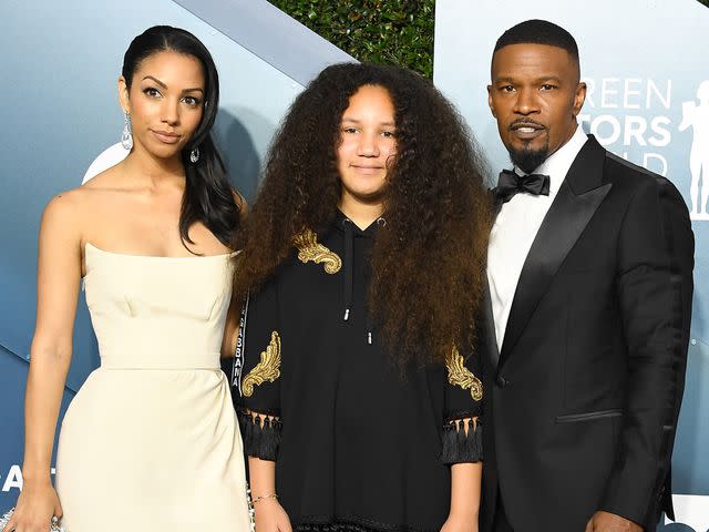 Steve Granitz/WireImage From left: Corinne Foxx, Annalise Bishop and Jamie Foxx arrive at the 26th Annual Screen Actors Guild Awards in January 2020.