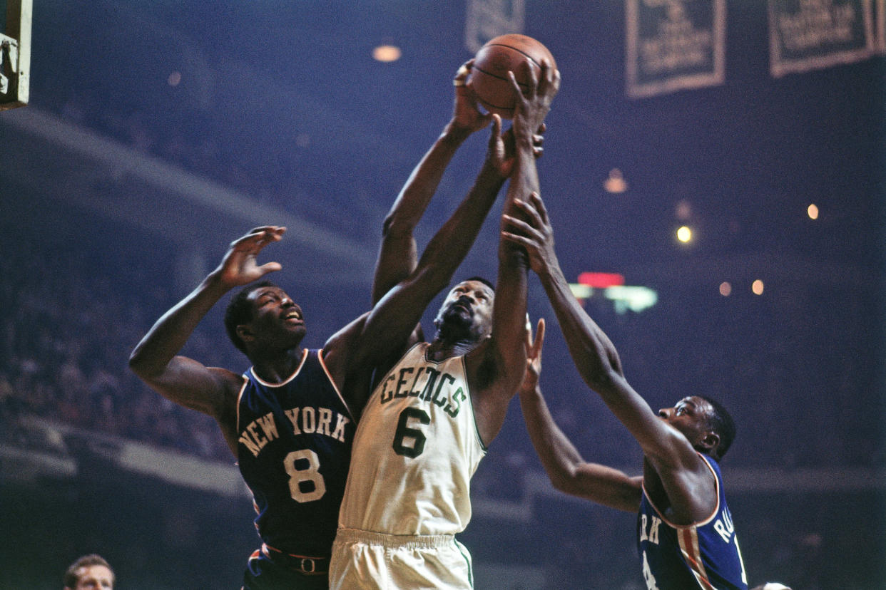 Bill Russell #6 of the Boston Celtics rebounds against Walt Bellamy #8 of the New York Knicks during a game in1967 at the Boston Garden. (Dick Raphael / NBAE via Getty Images file)