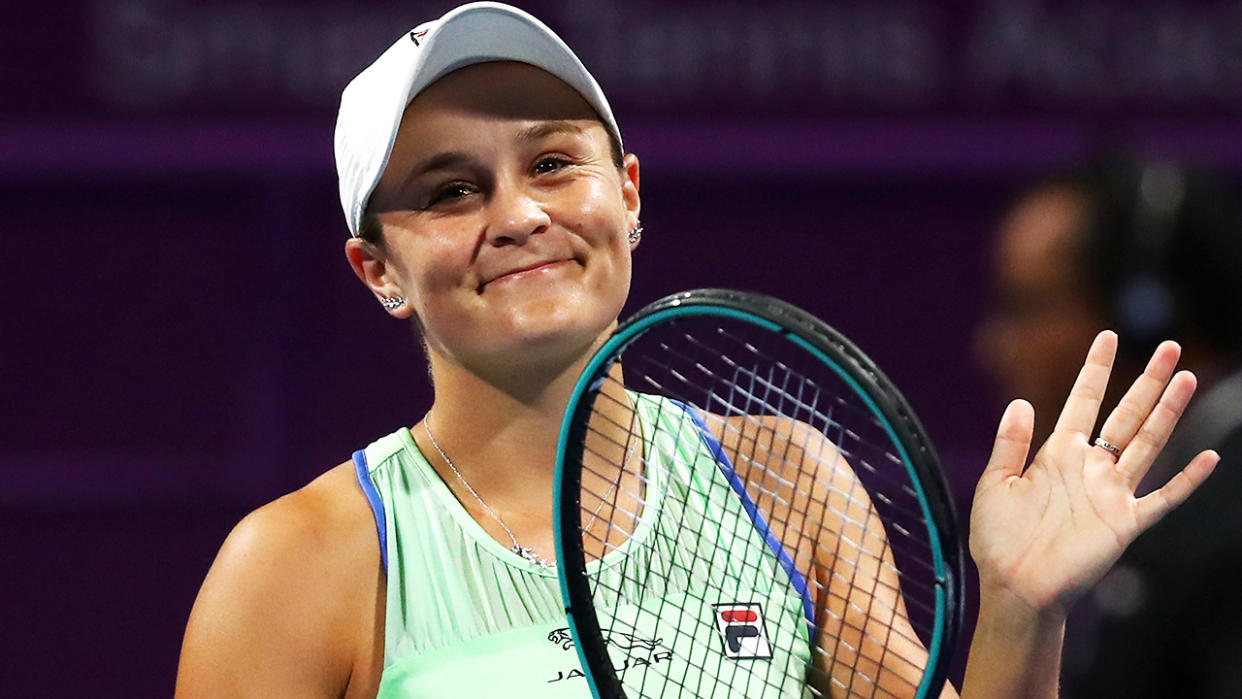 Ash Barty is pictured smiling after winning a match at the Qatar Open in 2020.