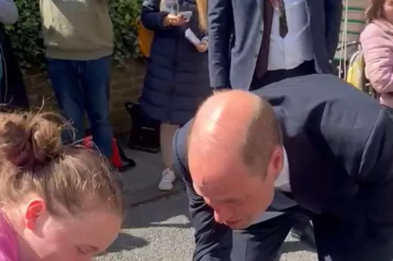 Prince William shakes Max's hand