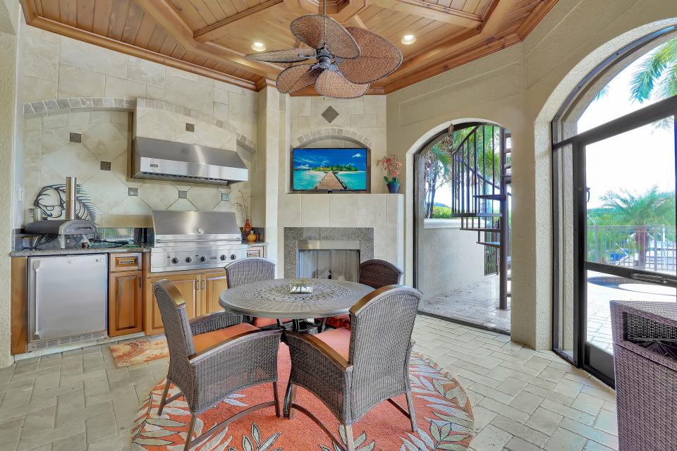Wood ceiling details are featured on the lanai and throughout the home.
