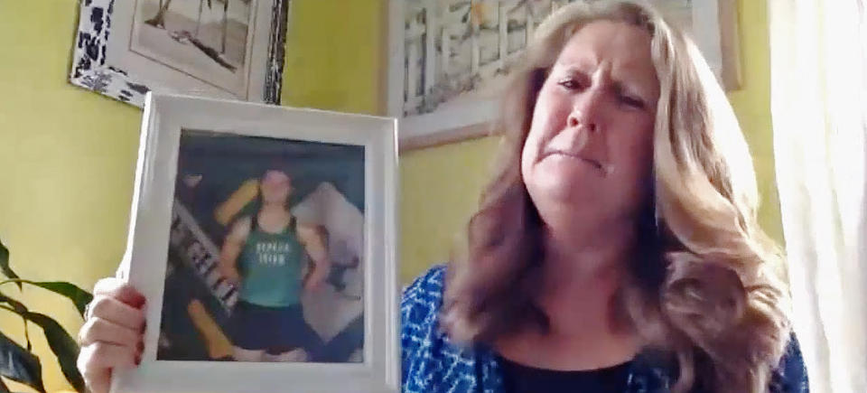 Lisa Moore holds a photo of her son, Trevor Till. (NBC Chicago)