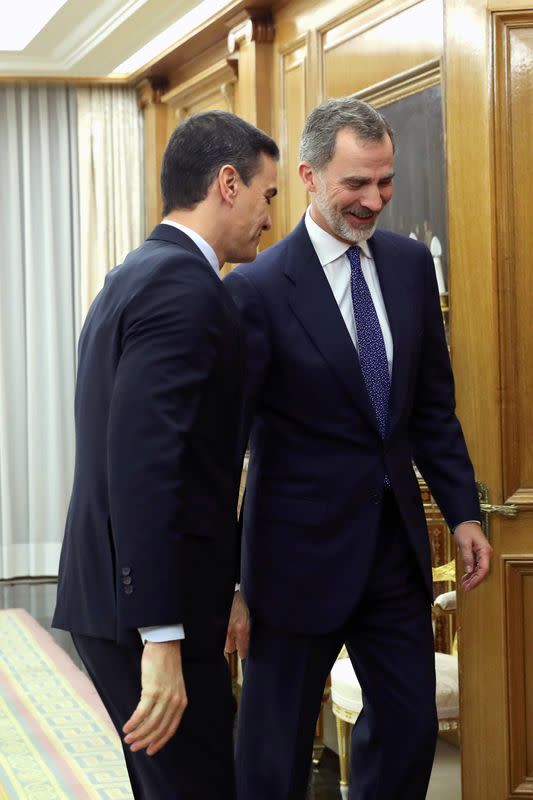 Spain's King Felipe greets acting PM Sanchez before their meeting in Madrid