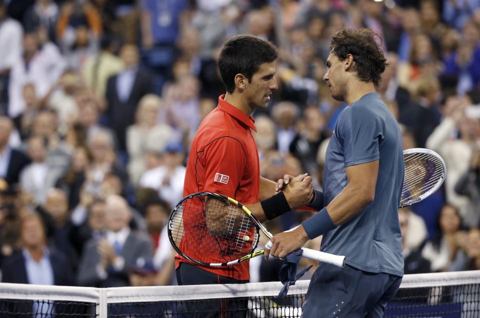 Nadal of Spain is congratulated by Djokovic of Serbia after his victory in their men's final match at the U.S. Open tennis championships in New York