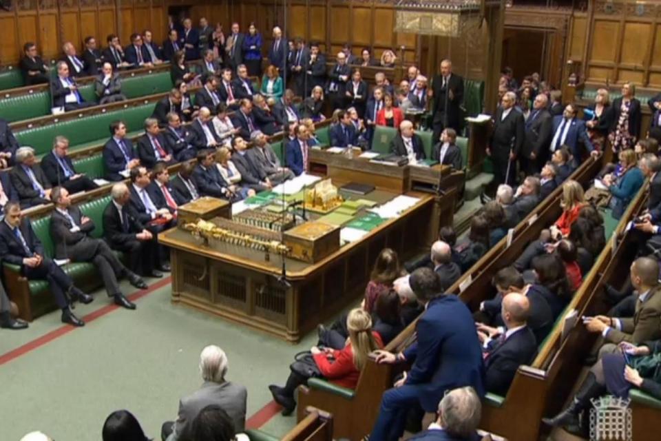 MPs wait for information in the House of Commons (PA)