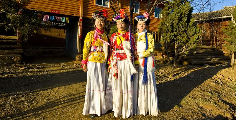 Mosuo tribe girls in traditional costume 