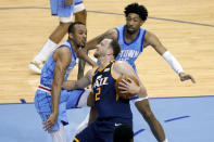 Utah Jazz guard Joe Ingles (2) pushes into Houston Rockets guard Armoni Brooks, left, on a drive to the basket as Houston Rockets center Christian Wood, right, looks on during the second half of an NBA basketball game Wednesday, April 21, 2021, in Houston. (AP Photo/Michael Wyke, Pool)